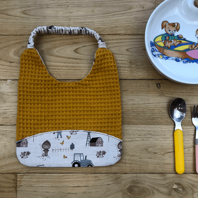 Bavoir jaune fermier, à élastique 